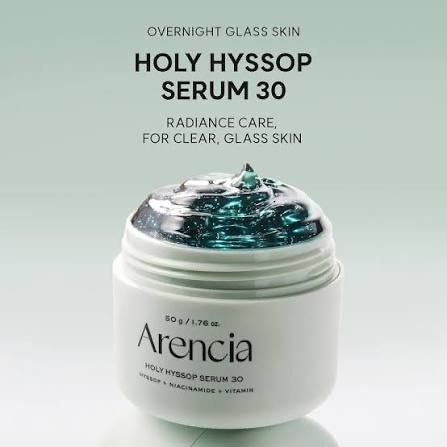 A white jar of Arencia Holy Hyssop Serum 30 with a clear lid showing blue-green gel inside, set against a light green gradient background with product text above.